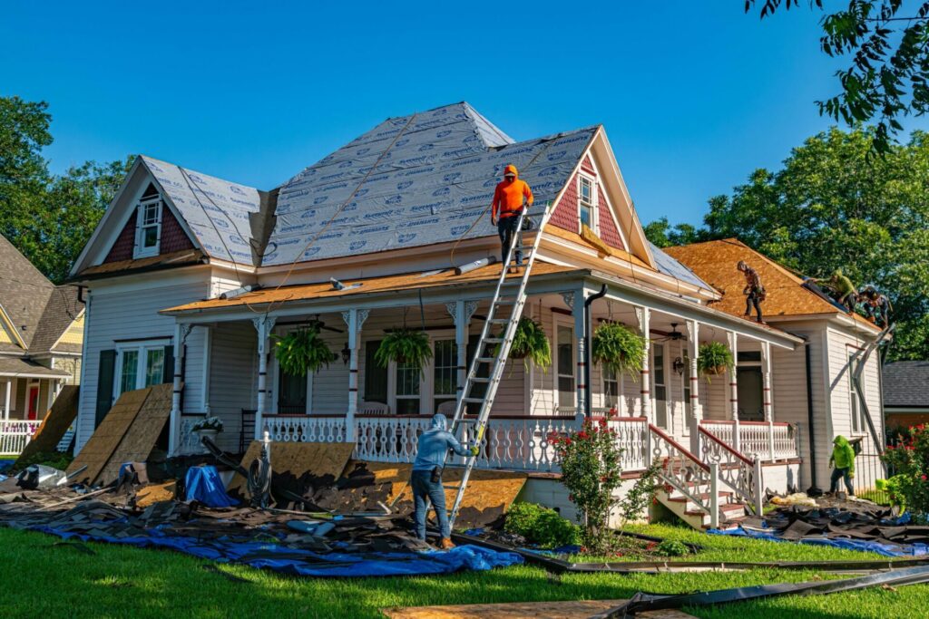 Roofing contractors replacing a damaged roof on a Nashville Tennessee home