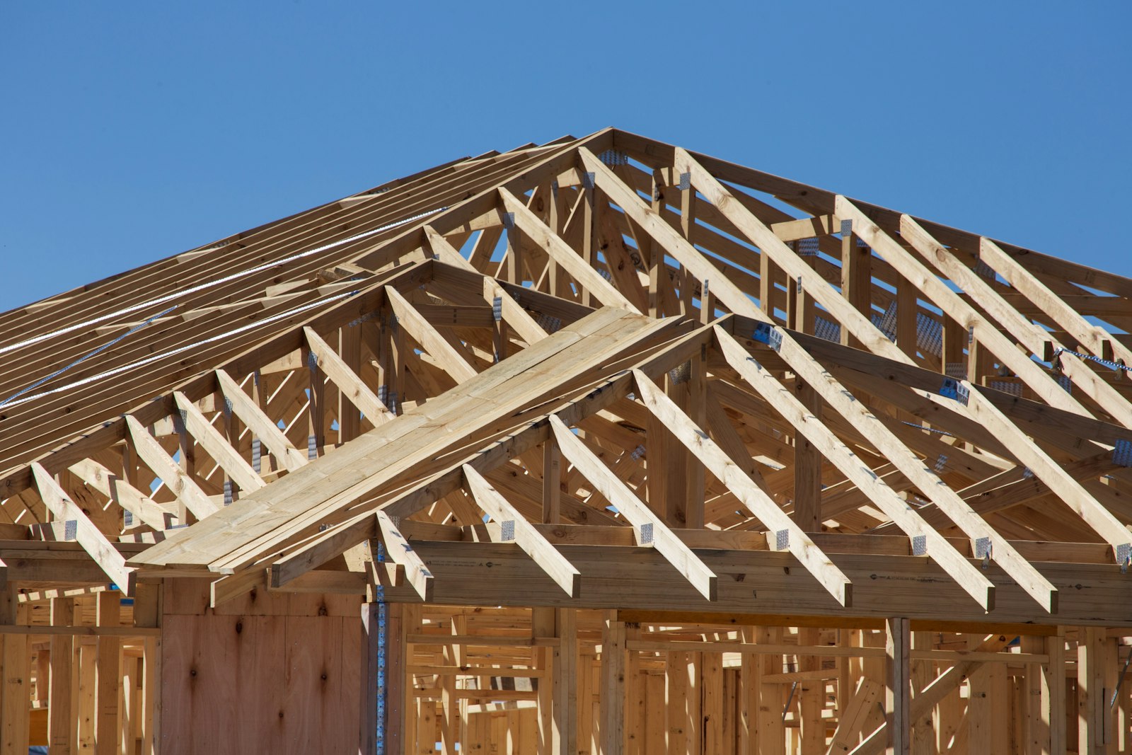 New home under construction with wooden roof framing in Nashville